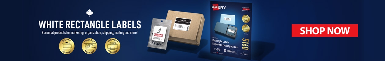 "Banner depicts Avery’s new White Rectangle Label packaging. Labels are shown as a shipping label on a box and warning label on product packaging.  Also displayed on the banner are medallions highlighting the benefits of Avery’s White Rectangle Labels: Easy Peel, TrueBlock and Sure Feed.   “White Rectangle Lables. Essential products for marketing, organizing, shipping, mailing and more!"